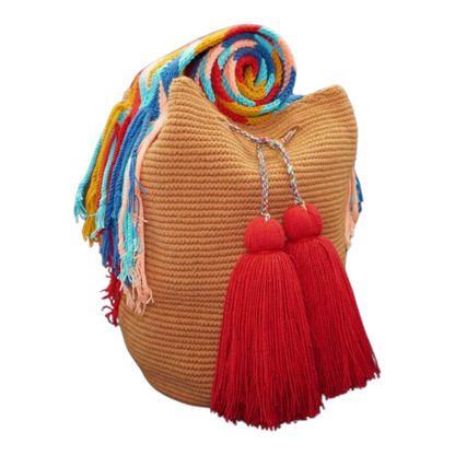 Handmade Caramel Handbag with Patterned Handel. this crochet bag has 2 deep red tassels 
