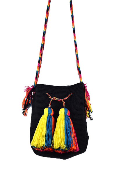 Black handbag with colorful tassels and strap on a white background